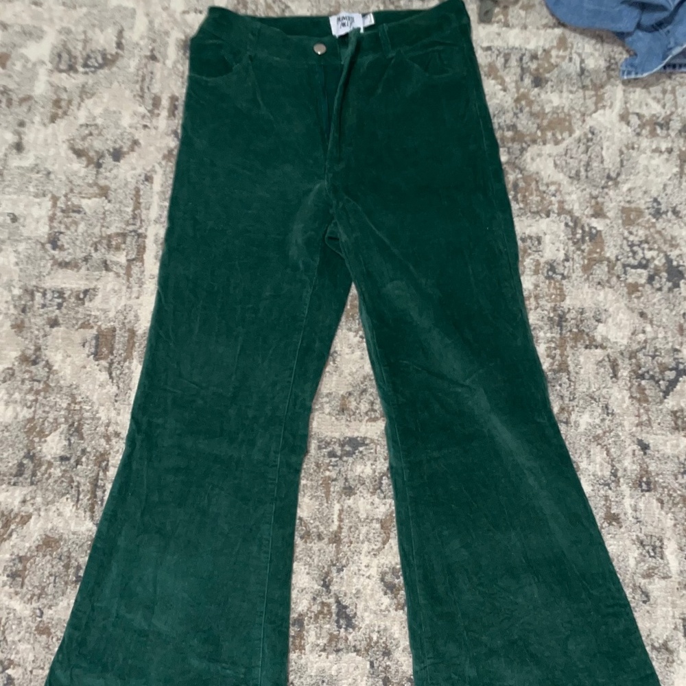 Princess Polly high waisted extreme flared velvet green pants. US size 25/26